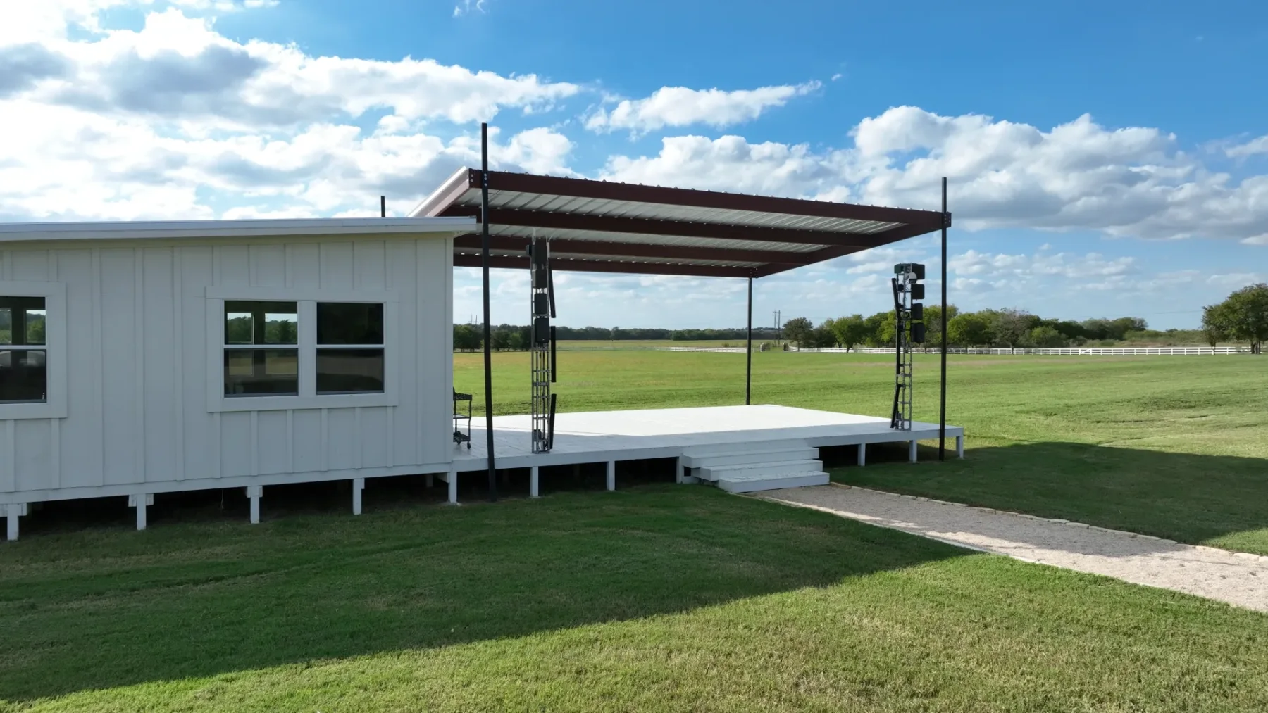 The covered main stage with its adjoining greenroom and open lawn