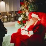 A child visits with Santa