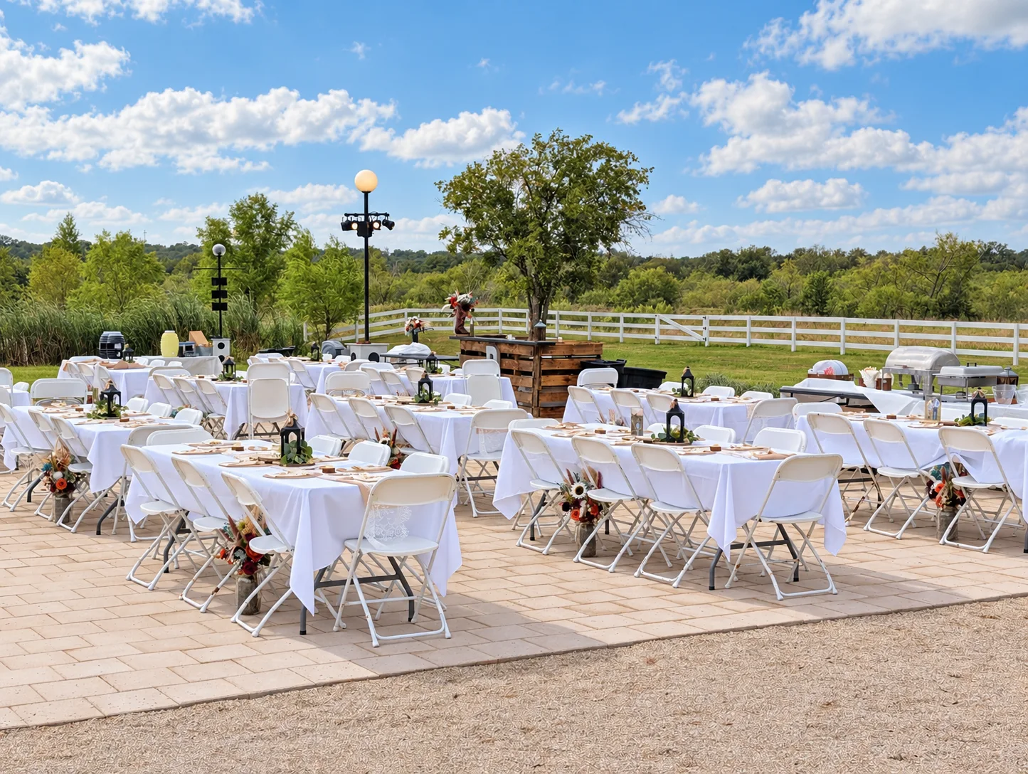 White linens and garden details at an outdoor wedding reception