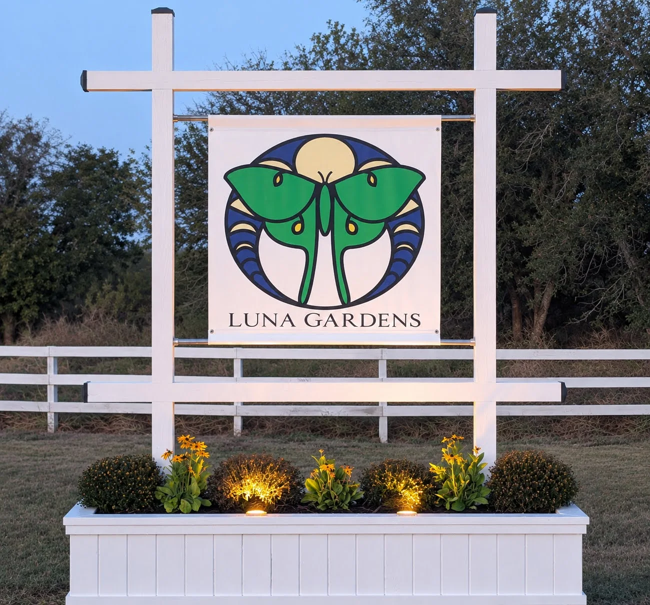 The new Luna Gardens entrance sign featuring the Luna moth and moon phases
